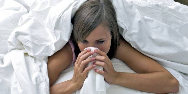 Woman in bed with Cold
